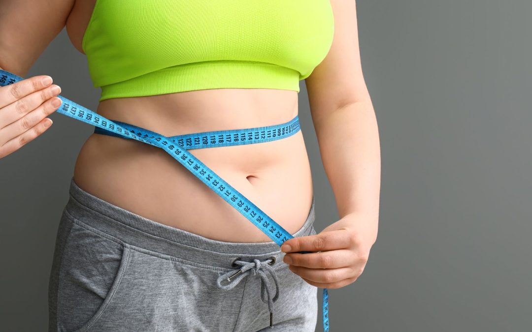 Overweight Woman with Measuring Tape on Grey Background. Weight Loss Concept